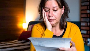 Woman looking at energy bill